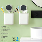 Drill-free adhesive bathroom organizer cups installed on a wall