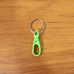 Lightweight mini plastic key hook with a metal ring, perfect for keys.