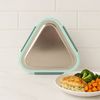 Close-up of Ganesh Trinity triangle lunch box leak-resistant locking clip