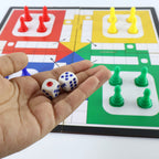 Children playing the portable Ludo board game together, enjoying family fun.