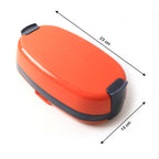 Electric lunch box warming food on an office desk