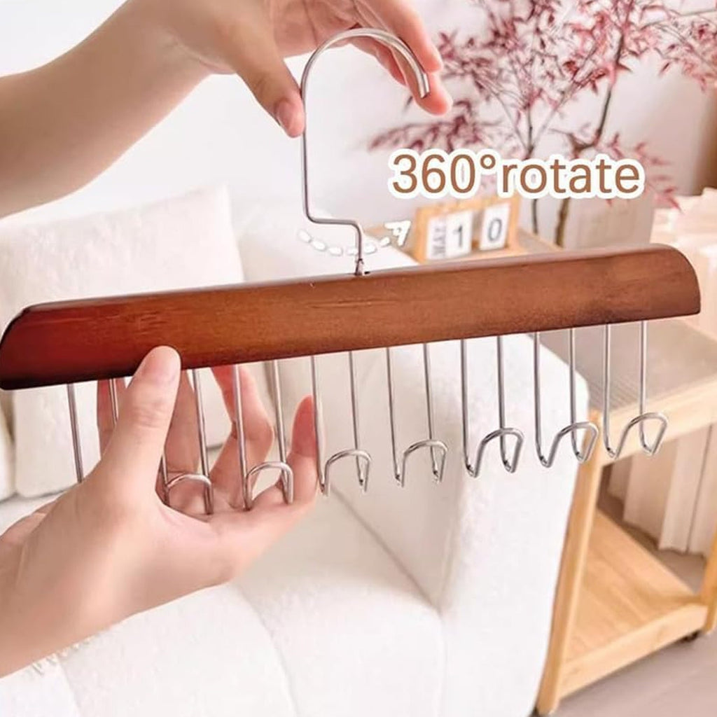 Organivo multi-purpose wooden hanger providing an organized solution for a cluttered closet.