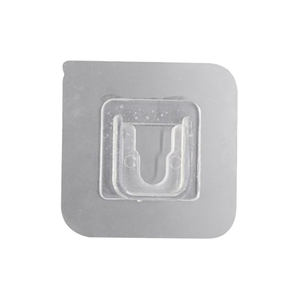 Transparent self-adhesive wall hook ready for easy peel-and-stick application.