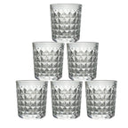 A stack of elegant diamond-cut glass tumblers, illustrating their compact storage and design.