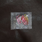 Colourful vinyl-coated paper clips securely holding important files and documents together.