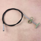Drain cleaner tool showing flexible spring cable