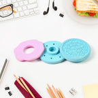 Generic packaging for a single biscuit eraser, ready for gifting.