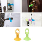 Silicone door stopper attached to a door handle, protecting the wall.