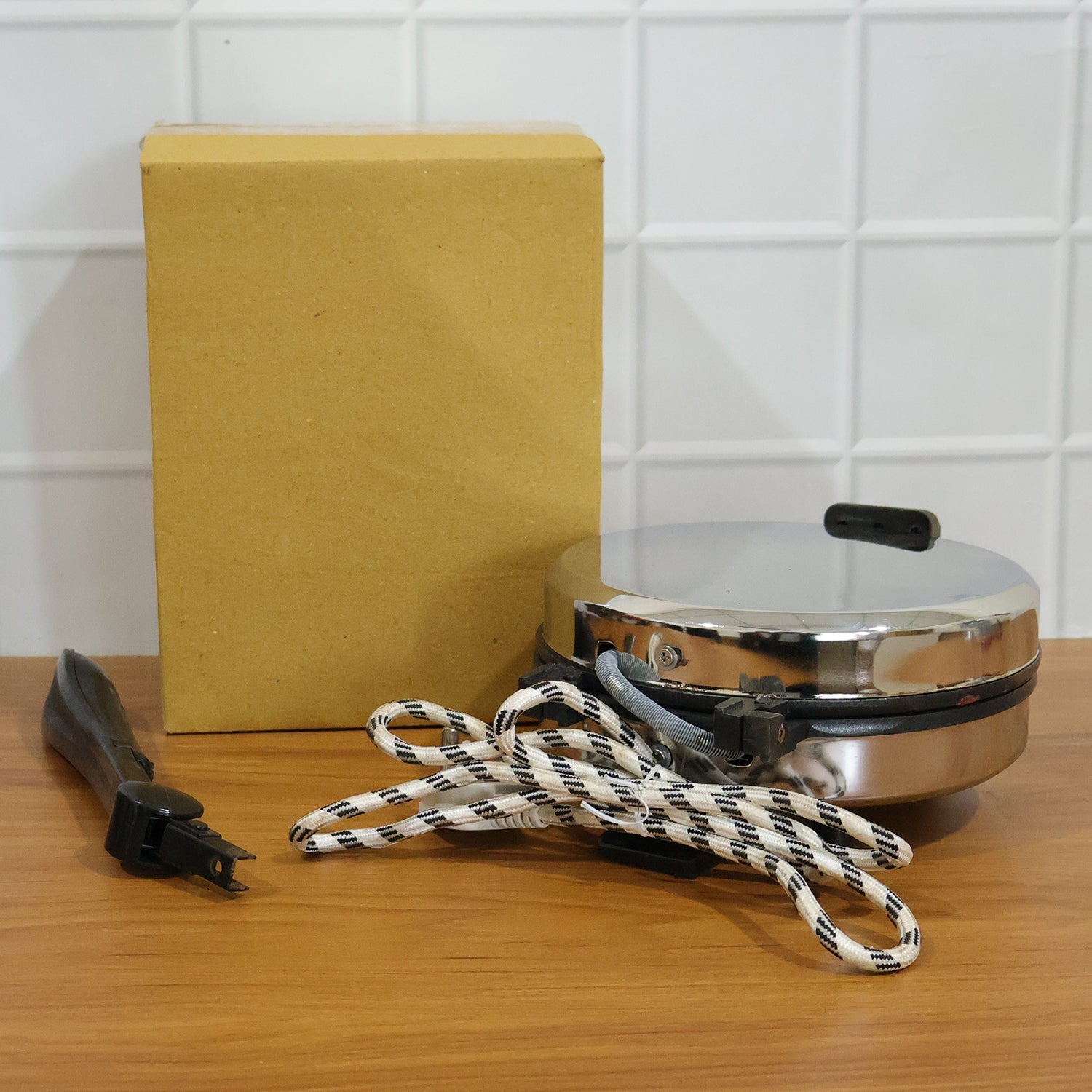 Comparison shot highlighting features of electric roti maker