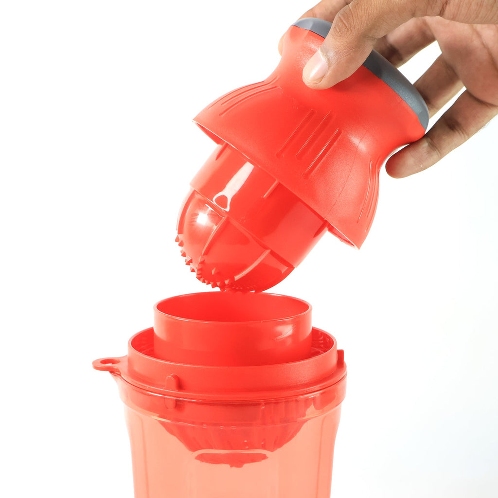 Side view of manual juicer handheld for portable use