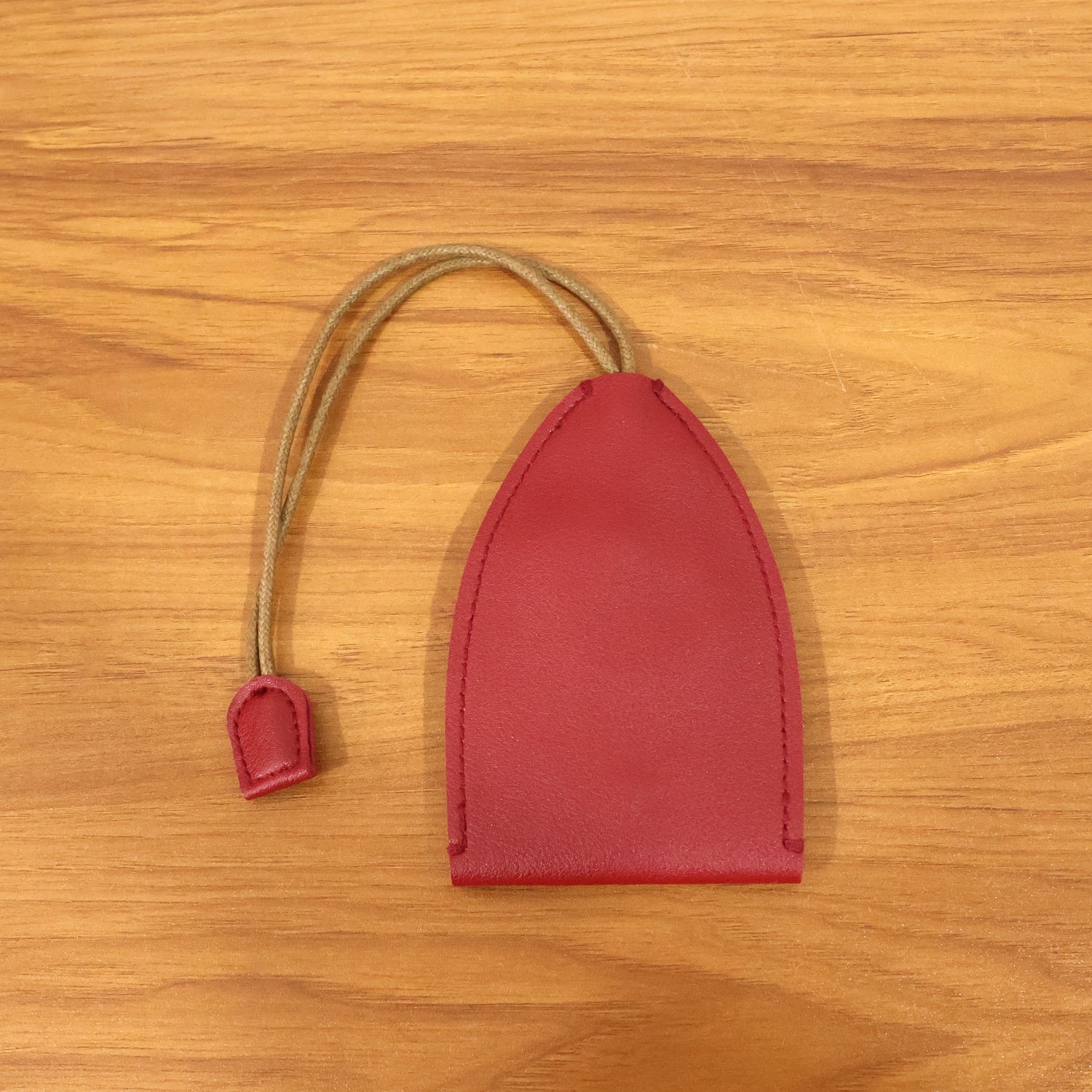 Metal keychain ring attached to a compact key pouch