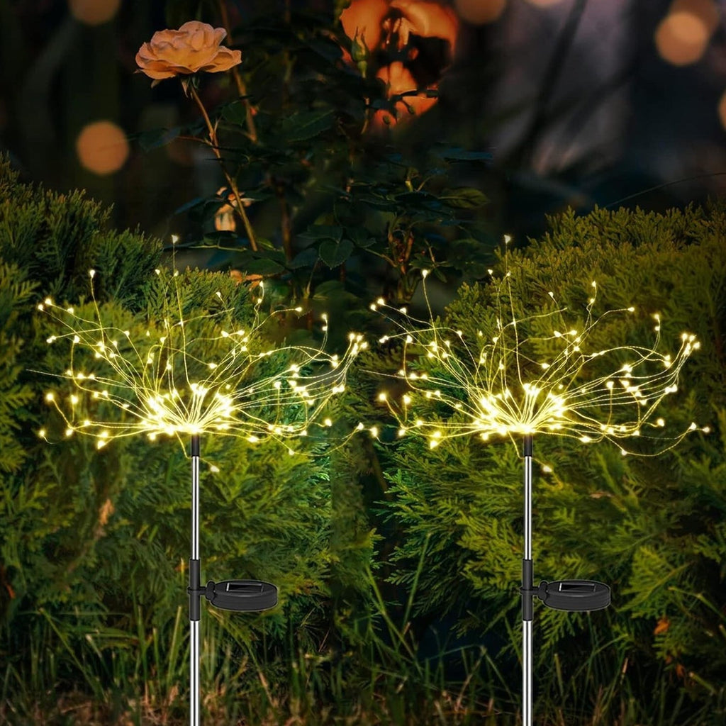 Decorative solar garden light with flexible branches in a starburst firework style
