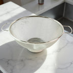 Dual ergonomic welded handles on stainless steel colander for easy grip
