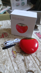 Compact electric nail clipper placed on a clean surface ready for use