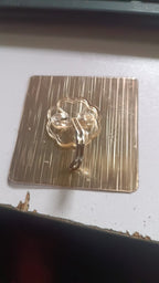Clear adhesive hook fixed on smooth wall surface