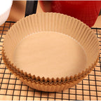 Pack of 50 round air fryer liners, ready for convenient kitchen use.