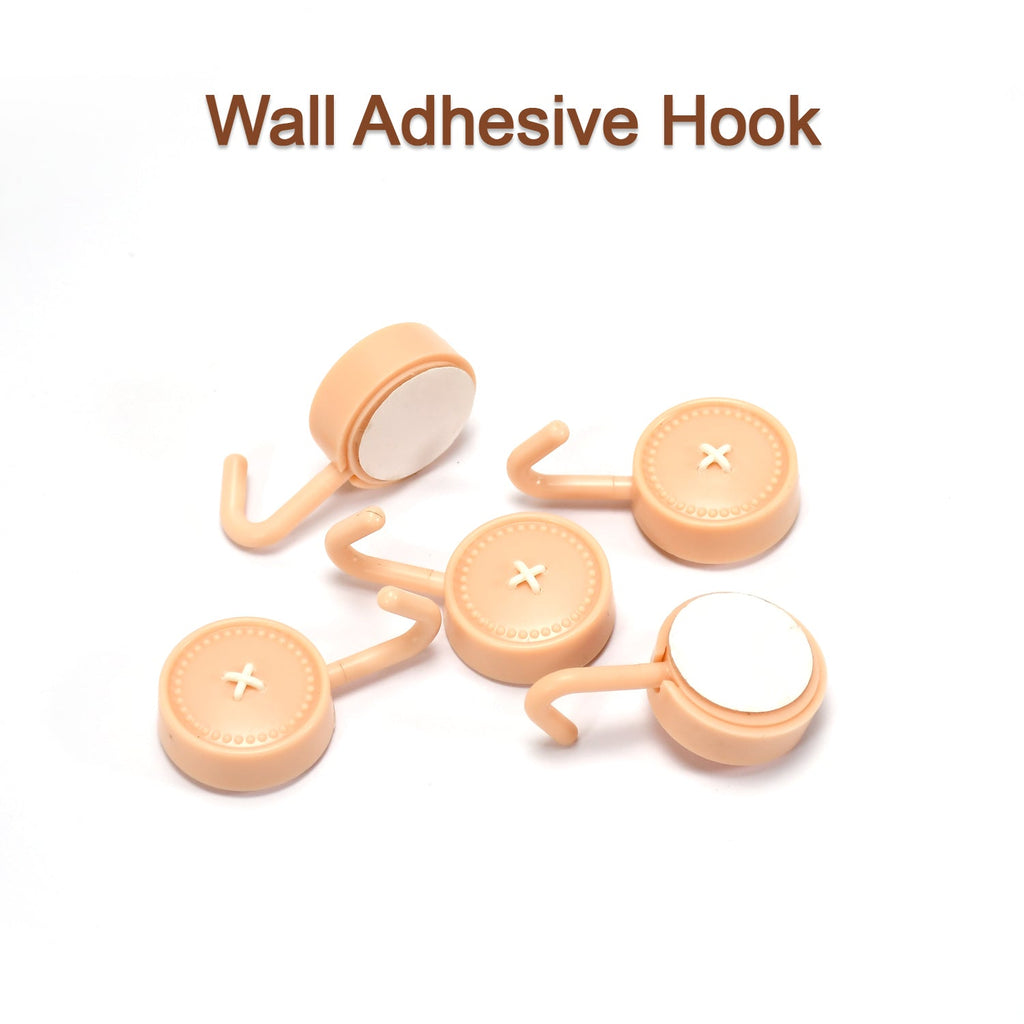 Sticky wall hooks in various home settings like bathroom and kitchen.
