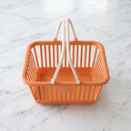 Basket filled with fruits and vegetables for grocery storage