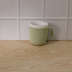 Close-up detail of the textured leather finish on the plastic mug