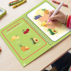 Toddler playing with magic water book, encouraging creativity