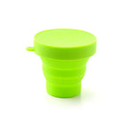 Expanded foldable silicone travel mug, ready for use with a beverage.
