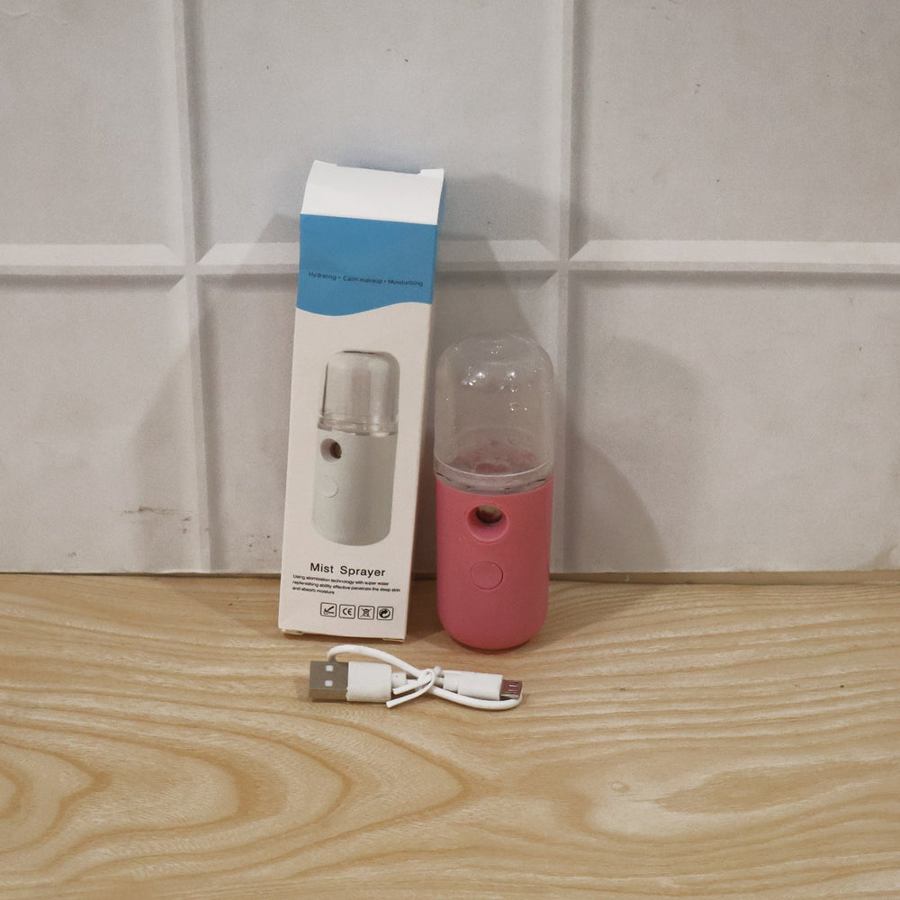 Woman using mist sprayer for daily skincare