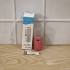 Woman using mist sprayer for daily skincare