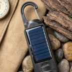 Camping lantern hanging inside a tent at night