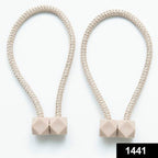 Close-up of a decorative magnetic curtain tieback, showcasing its strong hexagonal magnet.