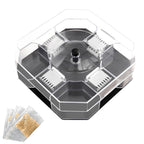 A clear plastic hexagonal trap with a dark gray base and internal silver grates is displayed with three packets of bait