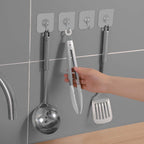 Wall hooks being used to hang items in home