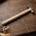 Wooden handle claw hammer with steel head for carpentry and DIY projects