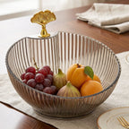 Serving fruit and snacks with decorative bowl on dining table
