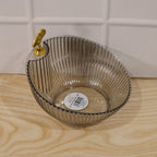 Packaging of decorative plastic fruit bowl with gold accent