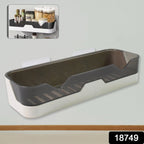 Close-up of the plastic adhesive shower caddy, highlighting its spacious design.