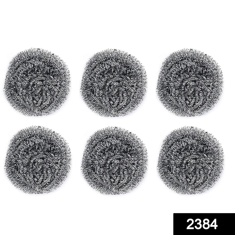 Heavy-duty stainless steel scrubber tackling tough grease on utensils.