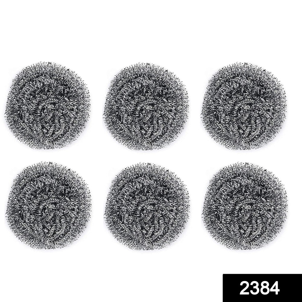 Heavy-duty stainless steel scrubber tackling tough grease on utensils.