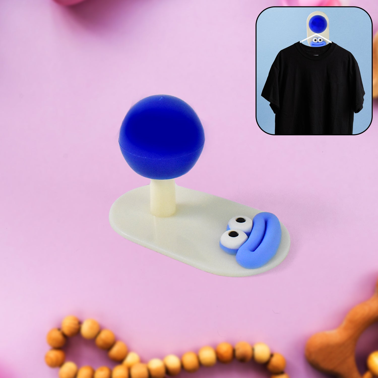 Self-adhesive colorful ball shape wall hook on cream background