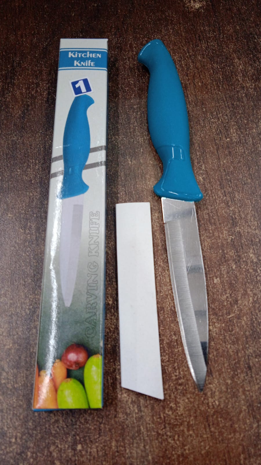 Detail of ergonomic plastic handle on multipurpose kitchen knife