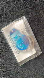Detailed close-up of blue cartoon character acrylic keychain