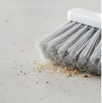 Close-up view of the treated hard fibre bristles of the household cleaning brush.
