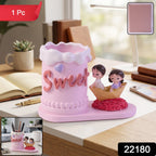 Pink resin couple pen holder packaged for gifting