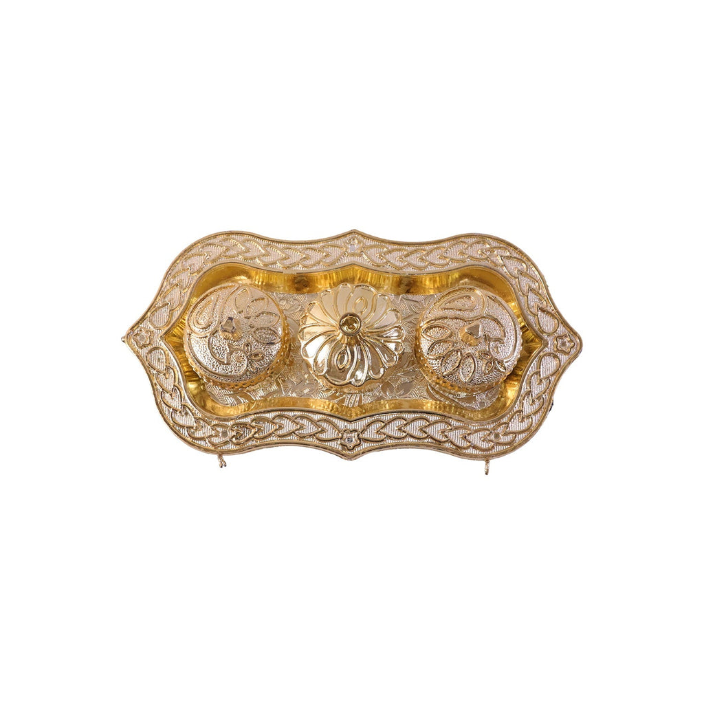 Studio shot of the golden Kankavati on a white background.