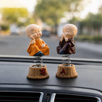 Close up of baby monk Buddha figurine expressions