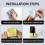 Phone charging in wall mount holder in a cozy bedroom setting.