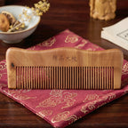 Close-up of polished wooden comb with smooth, fine teeth