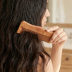 Men and women using wooden comb for daily hair care