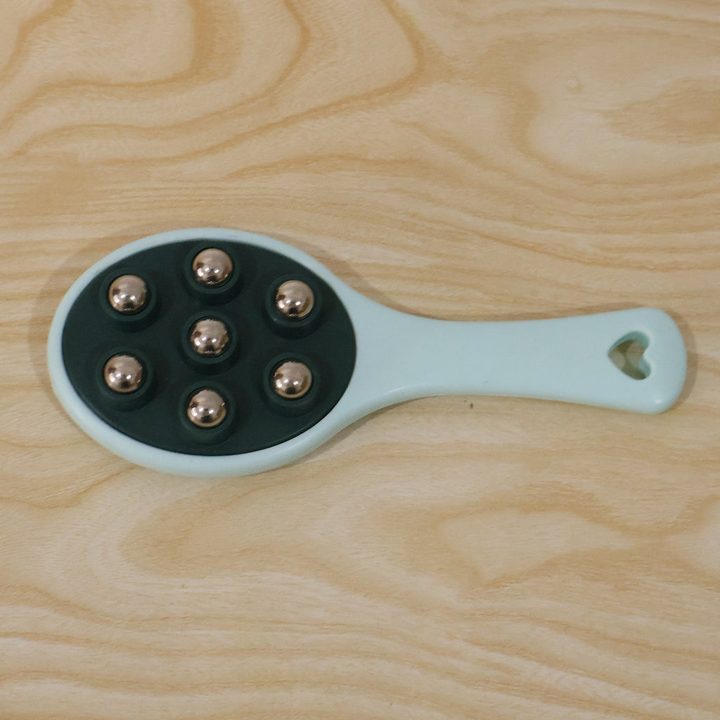 Handheld roller ball massager in retail packaging.