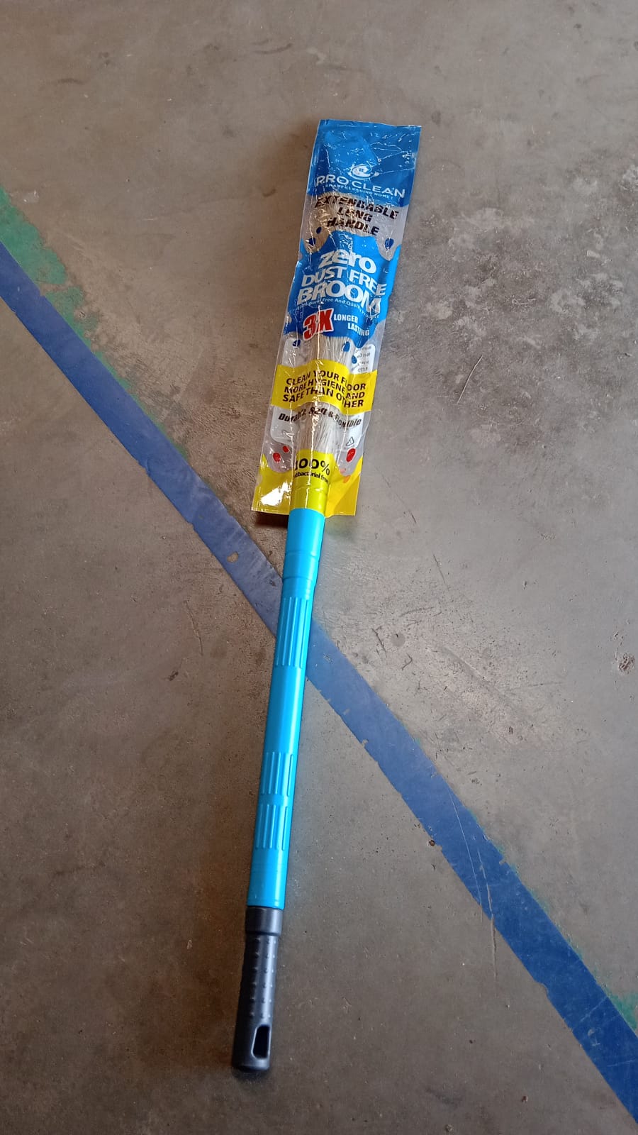 Adjustable height broom with synthetic bristles for effective dust removal