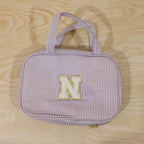 Detailed view of multi-pocket toiletry pouch with compartments